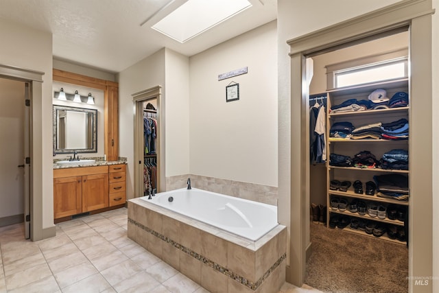 4763 S Skyridge Way, Boise, ID 83709 - full bath featuring vanity, a spacious closet, a bath, and tile patterned flooring