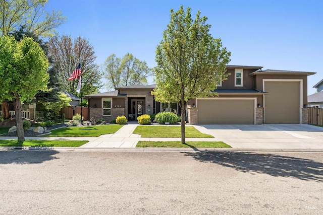 4763 S Skyridge Way, Boise, ID 83709 - prairie-style house with concrete driveway, stone siding, and a garage