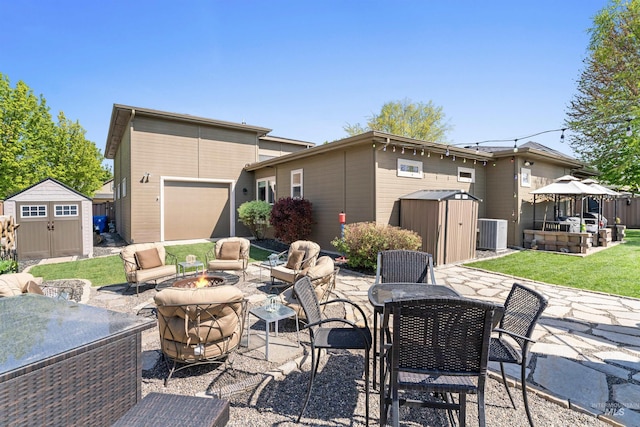 4763 S Skyridge Way, Boise, ID 83709 - view of patio / terrace with an outdoor living space with a fire pit, central AC unit, outdoor dining area, and a garage