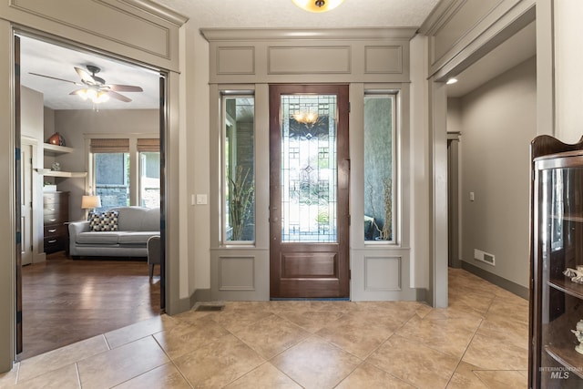 4763 S Skyridge Way, Boise, ID 83709 - foyer featuring light tile patterned flooring, a ceiling fan, and baseboards