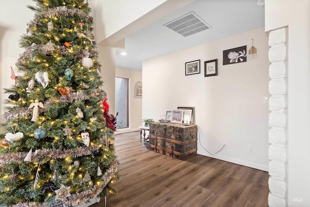 corridor featuring hardwood / wood-style floors