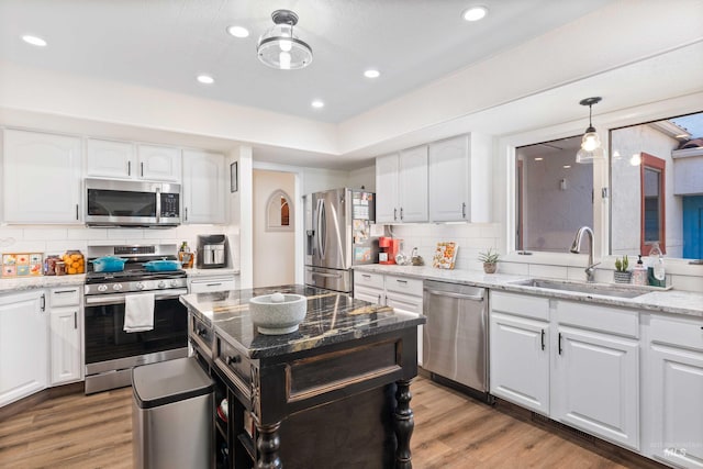 kitchen featuring white cabinets, sink, and appliances with stainless steel finishes