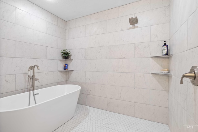 bathroom featuring tile patterned floors and a tub