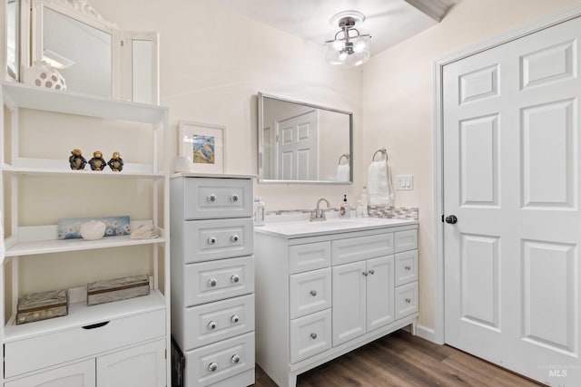 bathroom with vanity and hardwood / wood-style flooring