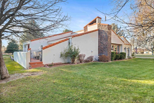 view of property exterior featuring a yard