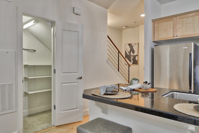 bathroom with wood-type flooring