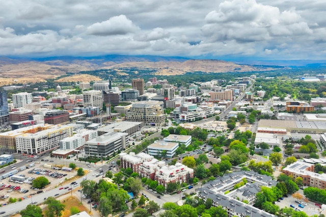 birds eye view of property with a mountain view