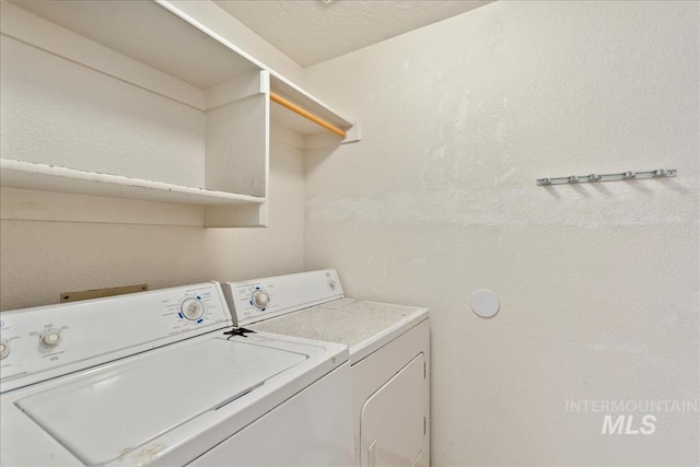 washroom with laundry area and separate washer and dryer