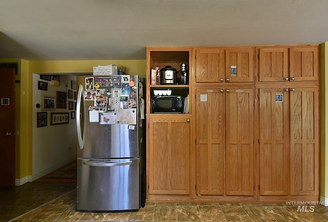 kitchen featuring stainless steel refrigerator