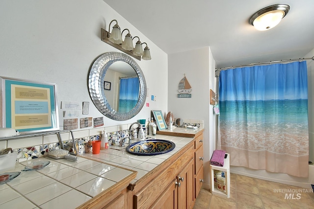 bathroom with vanity and shower / tub combo with curtain