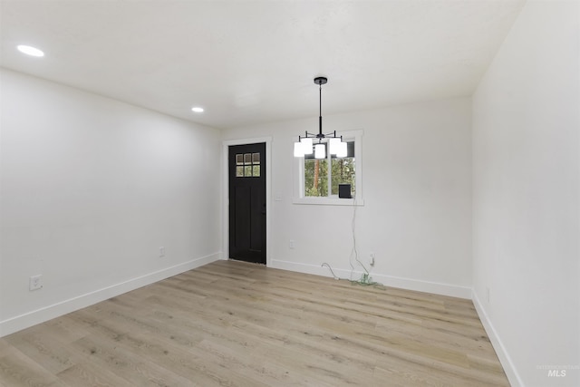 unfurnished dining area featuring recessed lighting, baseboards, and light wood finished floors