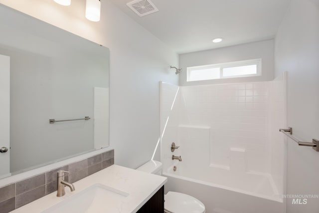 full bathroom featuring bathtub / shower combination, visible vents, vanity, and toilet