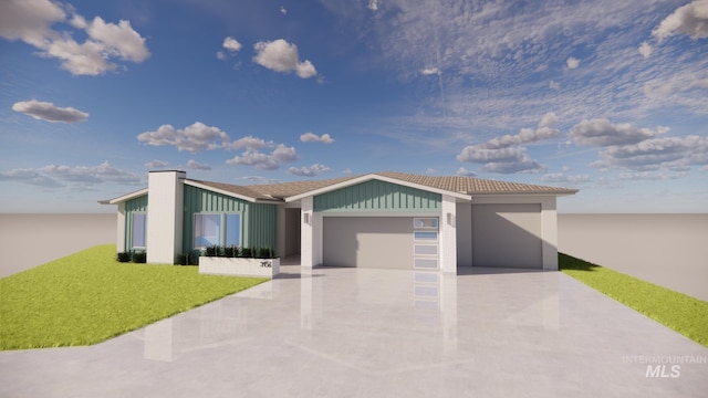 view of front of house featuring a front lawn, an attached garage, board and batten siding, and driveway