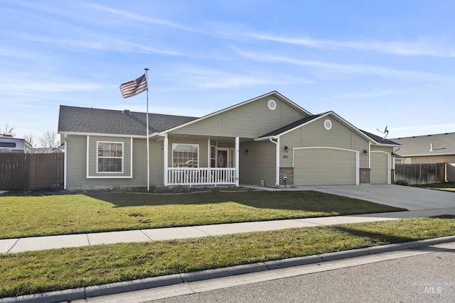 ranch-style home with a front yard, a garage, and covered porch