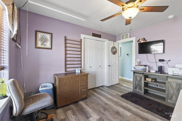 office area with ceiling fan and hardwood / wood-style floors