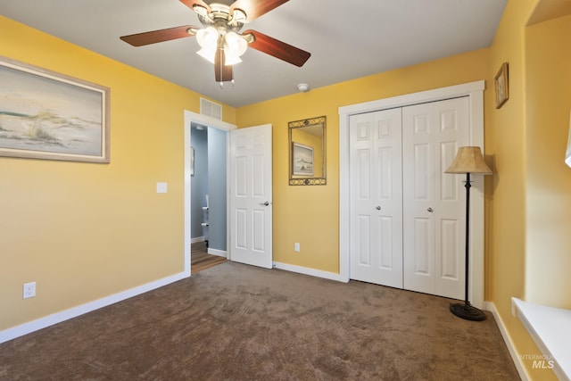 unfurnished bedroom featuring a closet, ceiling fan, and carpet floors