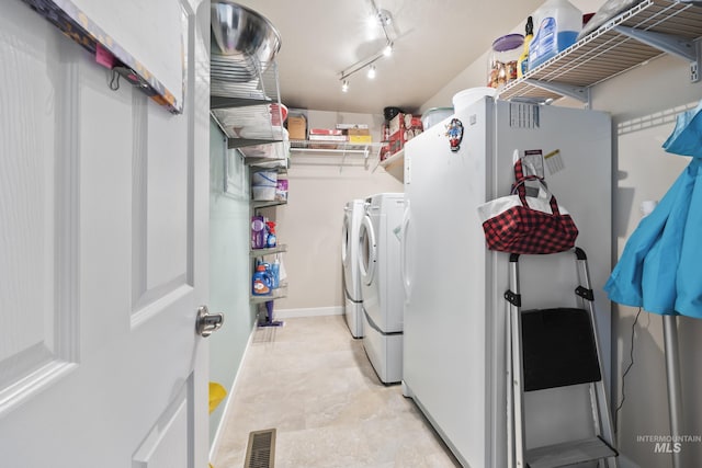 laundry area with separate washer and dryer