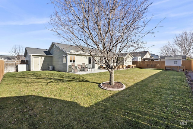 view of yard with a patio and a storage unit