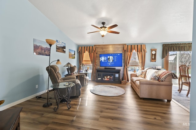 living room with vaulted ceiling, ceiling fan, and dark hardwood / wood-style floors