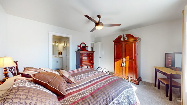 bedroom with carpet floors, ceiling fan, and ensuite bathroom