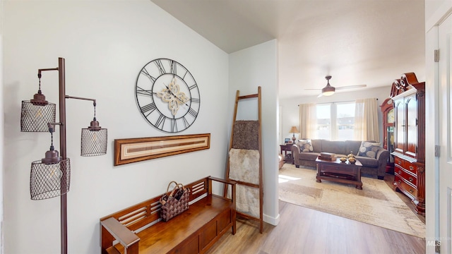 interior space featuring light wood finished floors and ceiling fan