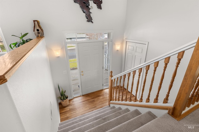 entryway with hardwood / wood-style floors