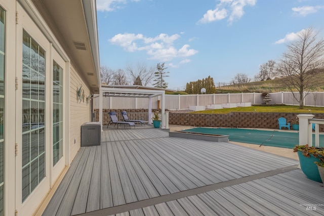 wooden terrace with a pergola and a covered pool