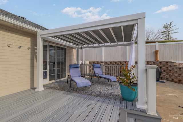 wooden terrace with a patio area