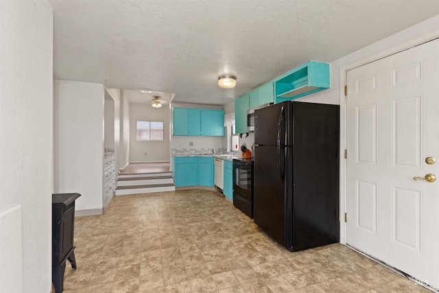 kitchen with black appliances, blue cabinets, light countertops, and a textured ceiling