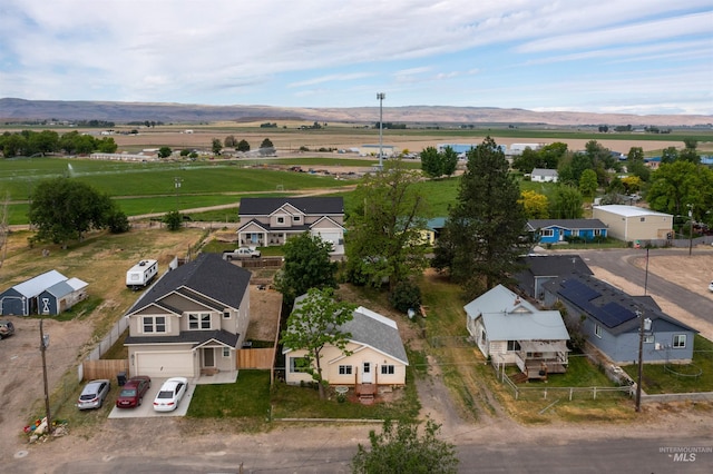 overview of rural landscape with a mountainous background and nearby suburban area