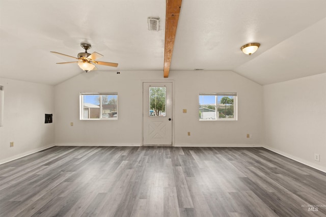 unfurnished living room with lofted ceiling, wood finished floors, a ceiling fan, and baseboards