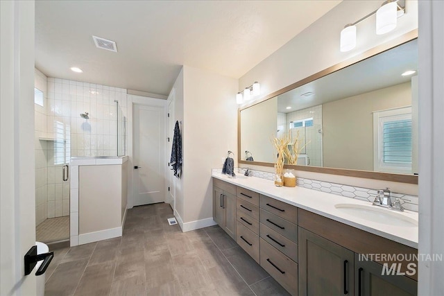 bathroom featuring vanity and walk in shower