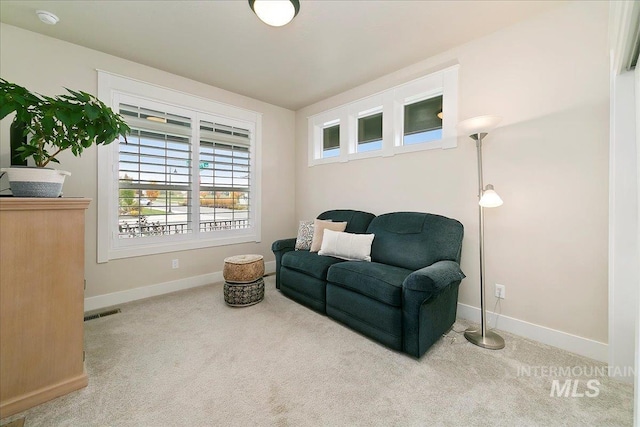 living area with carpet flooring