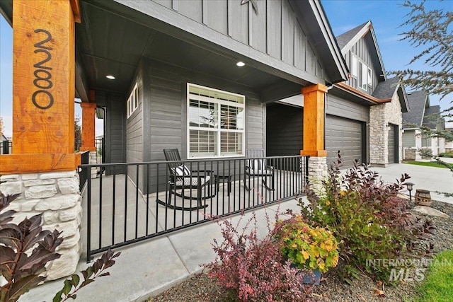 exterior space with a porch and a garage