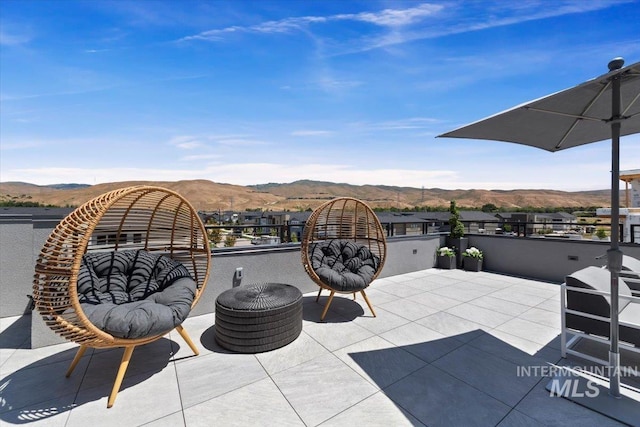 view of patio with a mountain view