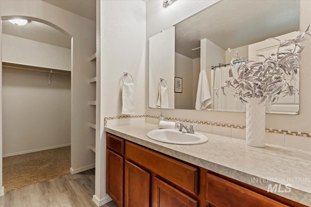 201 W Lava Fls, Meridian, ID 83646 - full bath featuring wood finished floors, vanity, a spacious closet, and curtained shower