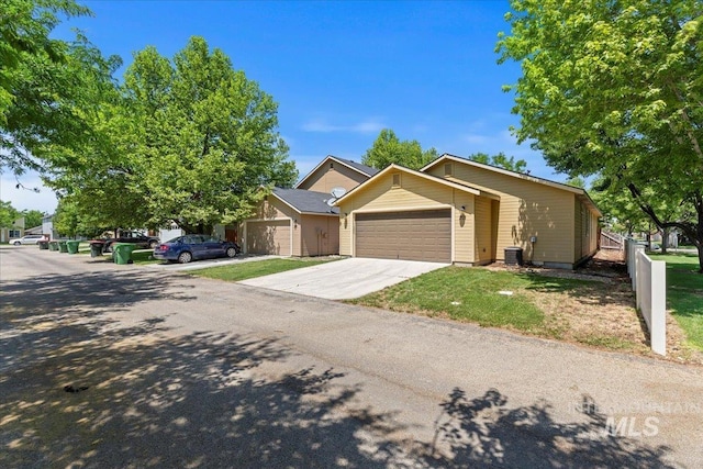 201 W Lava Fls, Meridian, ID 83646 - view of front of home with a garage, central air condition unit, and driveway