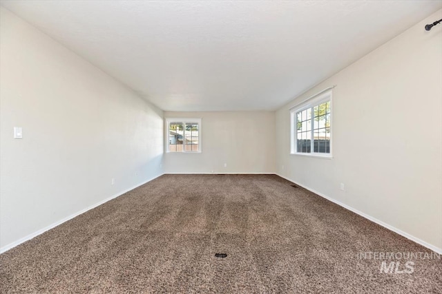 unfurnished room featuring carpet flooring