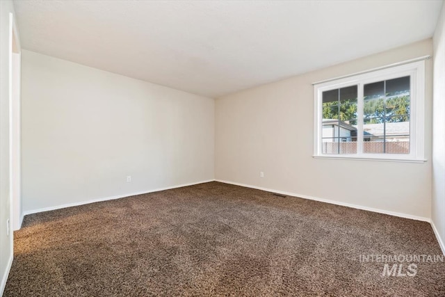 unfurnished room featuring carpet floors