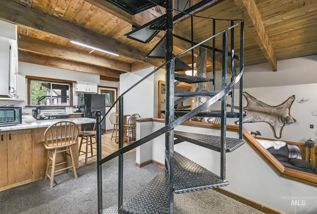 1011 E 1000 S, Albion, ID 83311 - stairway with wooden ceiling with exposed beams and carpet floors