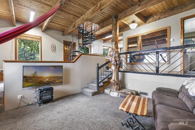1011 E 1000 S, Albion, ID 83311 - living area with wooden ceiling with exposed beams, a wood stove, carpet floors, stairway, and healthy amount of natural light