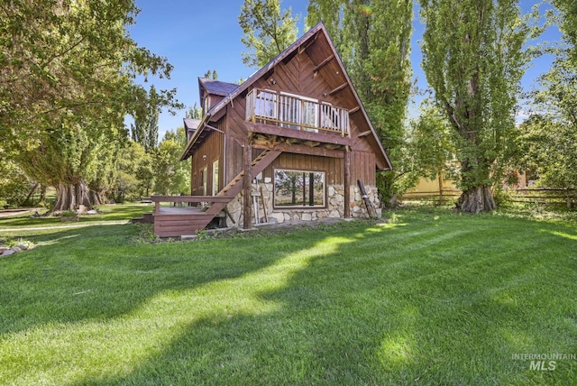 1011 E 1000 S, Albion, ID 83311 - back of house with a lawn, stone siding, and a deck