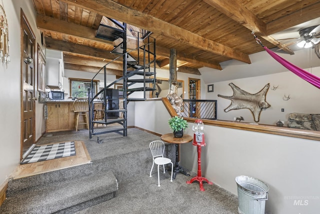 1011 E 1000 S, Albion, ID 83311 - interior space featuring wood ceiling with exposed beams, carpet flooring, a ceiling fan, baseboards, and stairs
