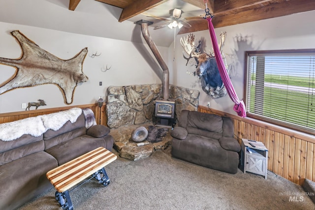 1011 E 1000 S, Albion, ID 83311 - living room with a wood stove, carpet floors, beam ceiling, a ceiling fan, and a wainscoted wall