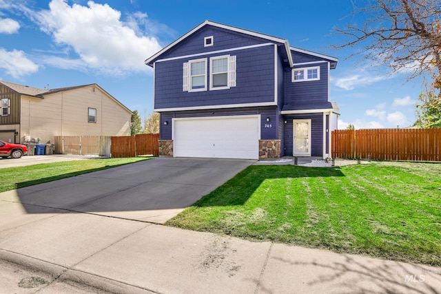 front of property featuring a garage and a front yard