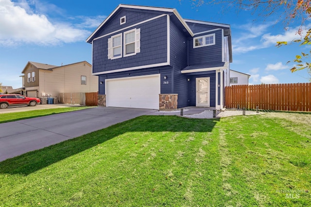 view of property with a front yard and a garage