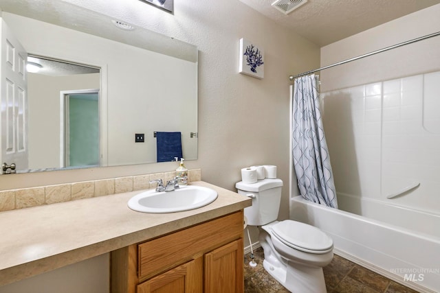 full bathroom featuring vanity, shower / tub combo, toilet, and a textured ceiling