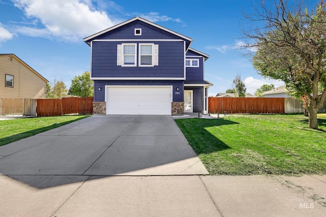 front facade featuring a front lawn and a garage