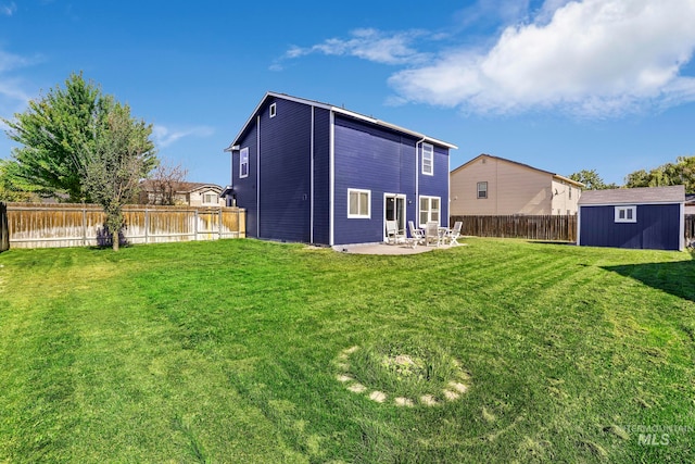 view of yard featuring a shed and a patio