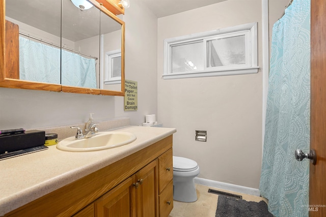 1817 Granada Dr, Twin Falls, ID 83301 - full bathroom with toilet, vanity, baseboards, and visible vents